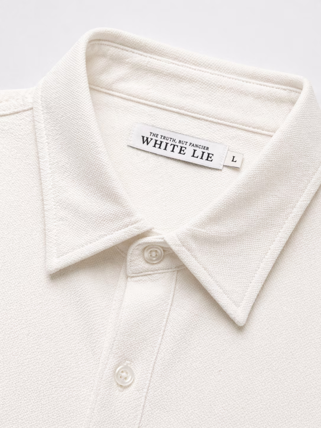 Collar and label close-up — The truth, but fancier